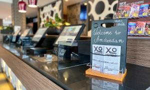 Ein Zertifikat, Auszeichnung, Logo oder anderes Dokument, das in der Unterkunft XO Hotels Park West ausgestellt ist