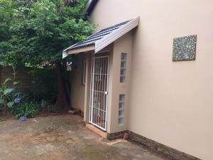 a door on the side of a house at Burban Bliss in Johannesburg