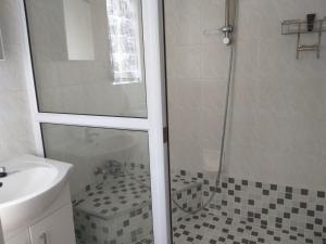 a bathroom with a shower and a sink at Burban Bliss in Johannesburg +11 photos