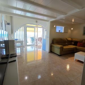 a living room with a couch and a table at Samoa Lovely Seaview in Playa del Ingles