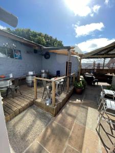 a patio with a table and chairs and a building at The Little Angel in Whitby