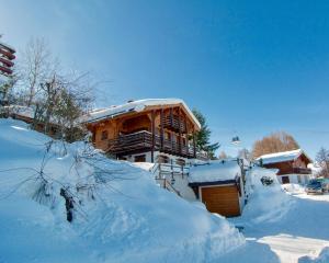 a house is covered in snow at Chalet Lisa Ski-in, ski-out Well equipped in Nendaz