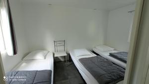 Postel nebo postele na pokoji v ubytování Camping LE Moulin