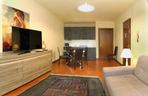 A television and/or entertainment centre at Claudio Appartamenti