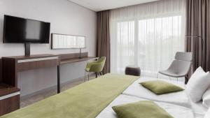 Postel nebo postele na pokoji v ubytování Hunguest Hotel Sóstó
