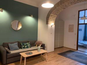 a living room with a couch and a table at French Touch Apartment with Free Parking in Budapest