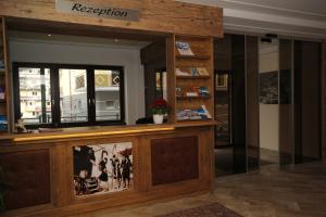a reception area of a building with a window at Hotel Bärenbachhof - Joker card included in summer in Saalbach Hinterglemm