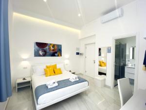 מיטה או מיטות בחדר ב-Villa Gabriella - Rooms & Breakfast