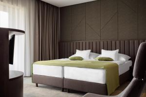 Postel nebo postele na pokoji v ubytování Hunguest Hotel Sóstó