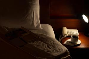 Letto o letti in una camera di Hotel Casa Kolping Quito