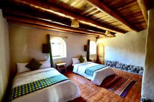 Katil atau katil-katil dalam bilik di Kinsapacha Eco Lodge Farm