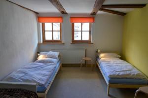 Postel nebo postele na pokoji v ubytování Buntspecht