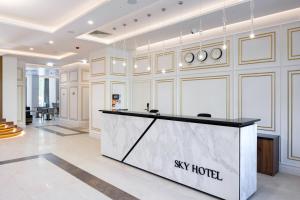 a lobby with a sky hotel reception desk at Sky Hotel Kraków in Kraków