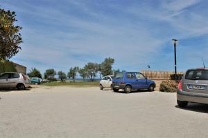 a group of cars parked in a parking lot at Zibibbo Beach Apartments - Trapani in Trapani
