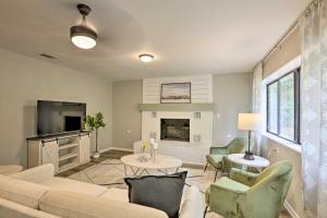 a living room with a couch and chairs and a fireplace at Stylish Sunshine State Escape - 2 Mi to FSU! in Tallahassee