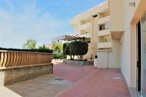 a walkway in front of a building at Zibibbo Beach Apartments - Trapani in Trapani
