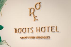 a sign that reads roos hotel show your memories at Roots Hotel in Faro
