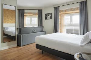 Tempat tidur dalam kamar di Hotel Arrizul Beach
