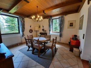 a dining room with a table and chairs at Villa Agnes in Semmering