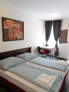 Postel nebo postele na pokoji v ubytování Apartmenthaus beim LKH Graz