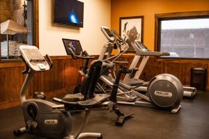 two exercise bikes in a gym with a tv at Elk Country Inn in Jackson