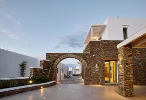 an entrance to a building with an archway at Nival Boutique Hotel in Sifnos