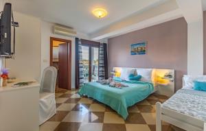 a bedroom with a bed with a doll on it at Villa San Rocco Bed & Breakfast in Medulin