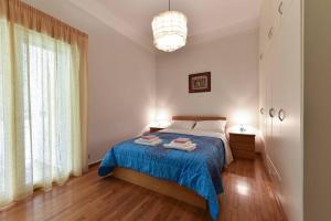 Posteľ alebo postele v izbe v ubytovaní nefeli apartment