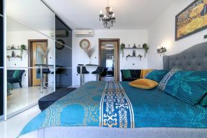 a hotel room with a large bed and a large window at Apartments Prpic in Senj