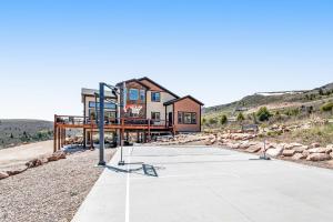 a basketball court in front of a house at Eagle Feather Lookout in Garden City