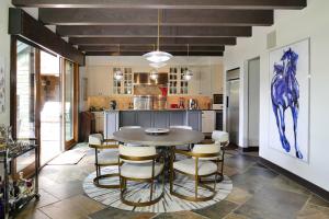 a dining room with a table and chairs in a kitchen at Country Club C & D in Telluride