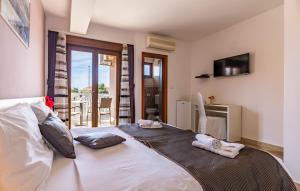 a bedroom with a bed with towels on it at Villa San Rocco Bed & Breakfast in Medulin