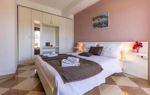 a bedroom with a large bed with towels on it at Villa San Rocco Bed & Breakfast in Medulin