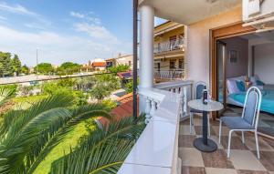 a balcony with a table and chairs and a view at Villa San Rocco Bed & Breakfast in Medulin