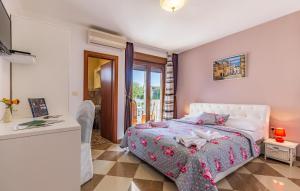 a bedroom with a white bed and a table at Villa San Rocco Bed & Breakfast in Medulin