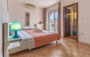 a bedroom with a bed with a lamp on it at Villa San Rocco Bed & Breakfast in Medulin