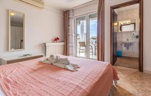 a bedroom with a bed with towels on it at Villa San Rocco Bed & Breakfast in Medulin