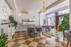 a dining room with a table and chairs at Villa San Rocco Bed & Breakfast in Medulin