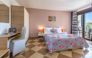 a bedroom with a bed with a desk and a table and chair at Villa San Rocco Bed & Breakfast in Medulin