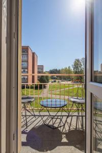 a view of a patio with a table and chairs at Apartamentai Druskininkų 7B in Palanga