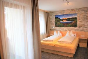 Postel nebo postele na pokoji v ubytování Haus Moostal