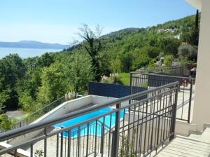 a balcony with a view of the water at Apartment Ivy2 in Lovran