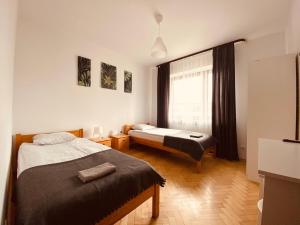 Postel nebo postele na pokoji v ubytování Pokoje Gajowa