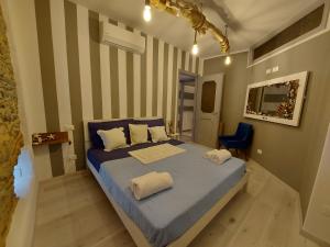 a bedroom with a bed with two pillows on it at Casa De Batté in Riomaggiore