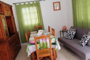 a living room with a table and a couch at Casita Abuela Rosa in Sabinosa