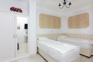 מיטה או מיטות בחדר ב-Villa Atlantis Homes 2