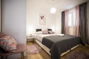Postel nebo postele na pokoji v ubytování Apartmani Lelu