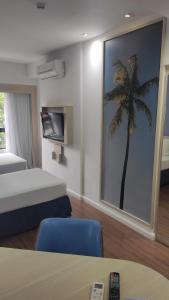 A bed or beds in a room at Mercure Recife Navegantes