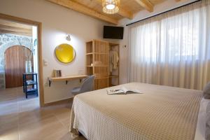 Posteľ alebo postele v izbe v ubytovaní Pnoes Villas Vasiliki Lefkada