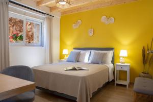 Posteľ alebo postele v izbe v ubytovaní Pnoes Villas Vasiliki Lefkada